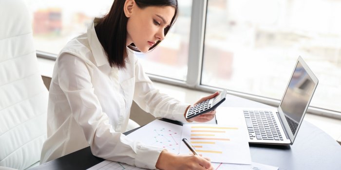 young female accountant working in office