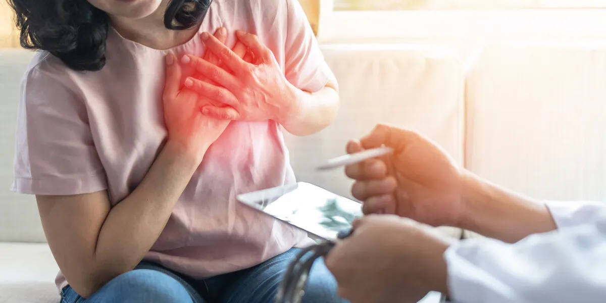 chest pain illness causing heart attck and stroke risk in woman patient with doctor examing and diagnosing patient health in hospital clinic chest pain illness causing heart attck and stroke risk in woman patient with doctor examing and diagnosing patient health in hospital clinic