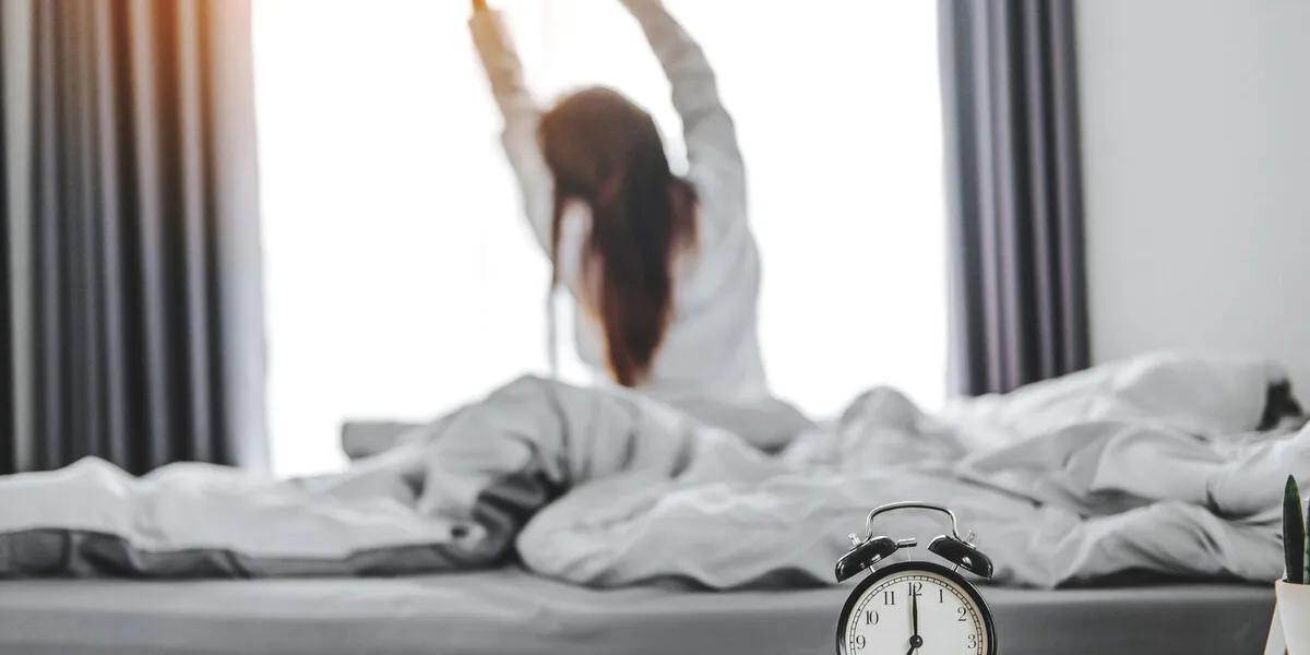 asian woman wake up on bed stretching feeling happy and fresh enjoying in the morning asian woman wake up on bed stretching feeling happy and fresh enjoying in the morning