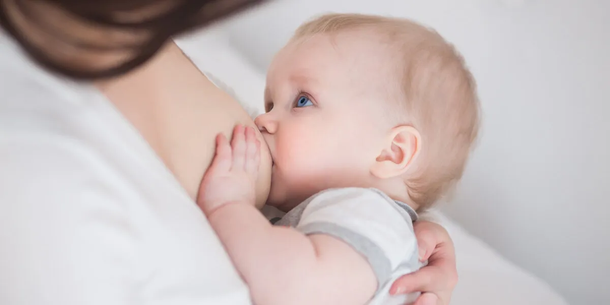 mother breast feeding and hugging her baby mother breast feeding and hugging her baby