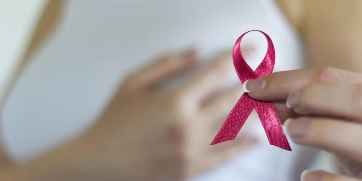 woman hold pink ribbon for breast cancer awareness woman hold pink ribbon for breast cancer awareness