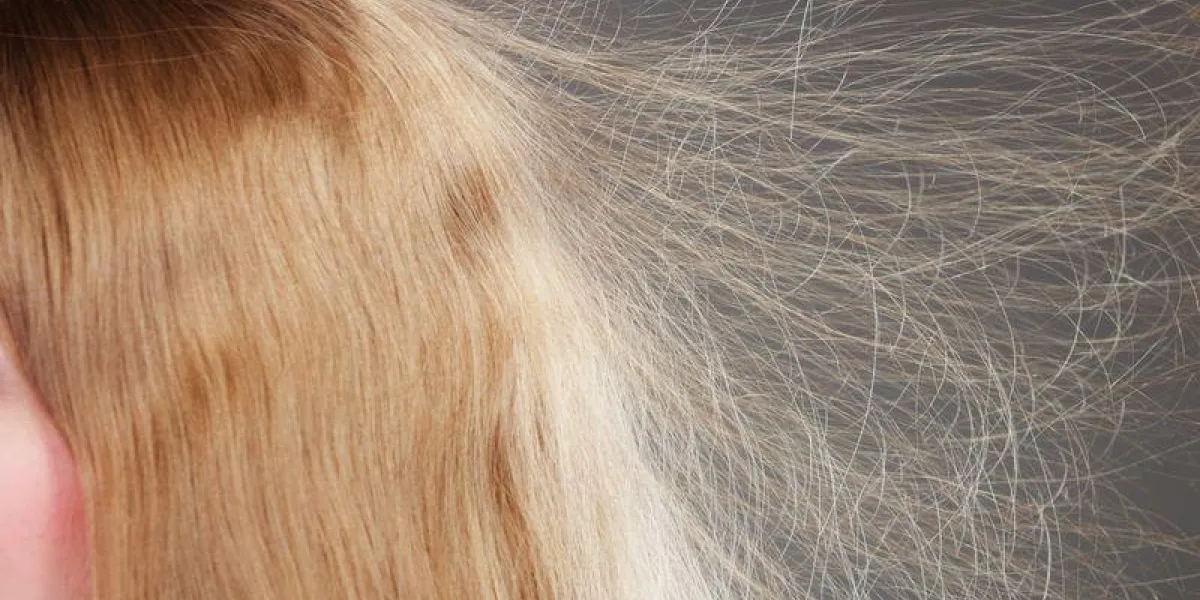 closeup of woman girl with static blonde long hair closeup of woman girl with static blonde long hair
