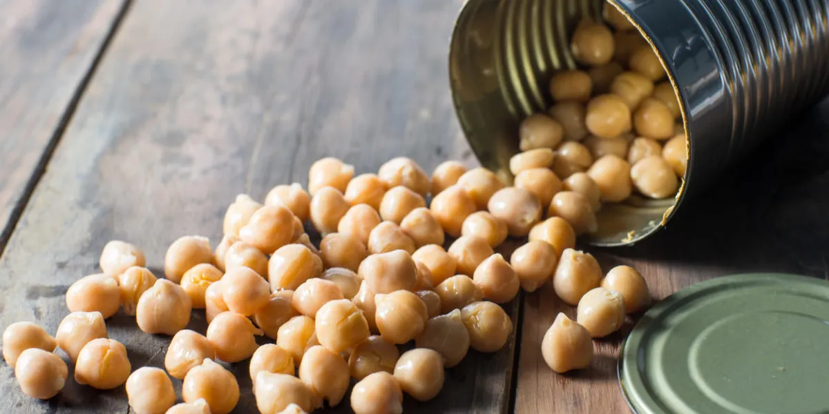 chick pea garbanzo beans falling out of open can chick pea garbanzo beans falling out of open can